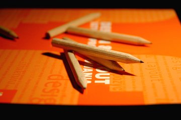 pencils-on-book-s-cover-orange-1198799